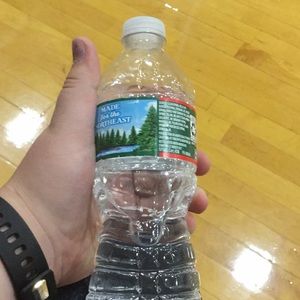 A water bottle from an Ariana Grande concert